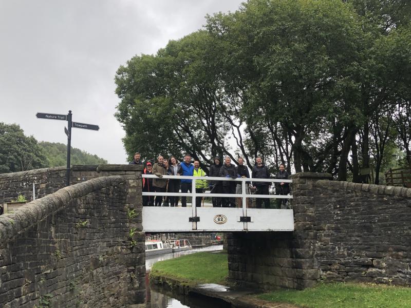 group standing on bridge
